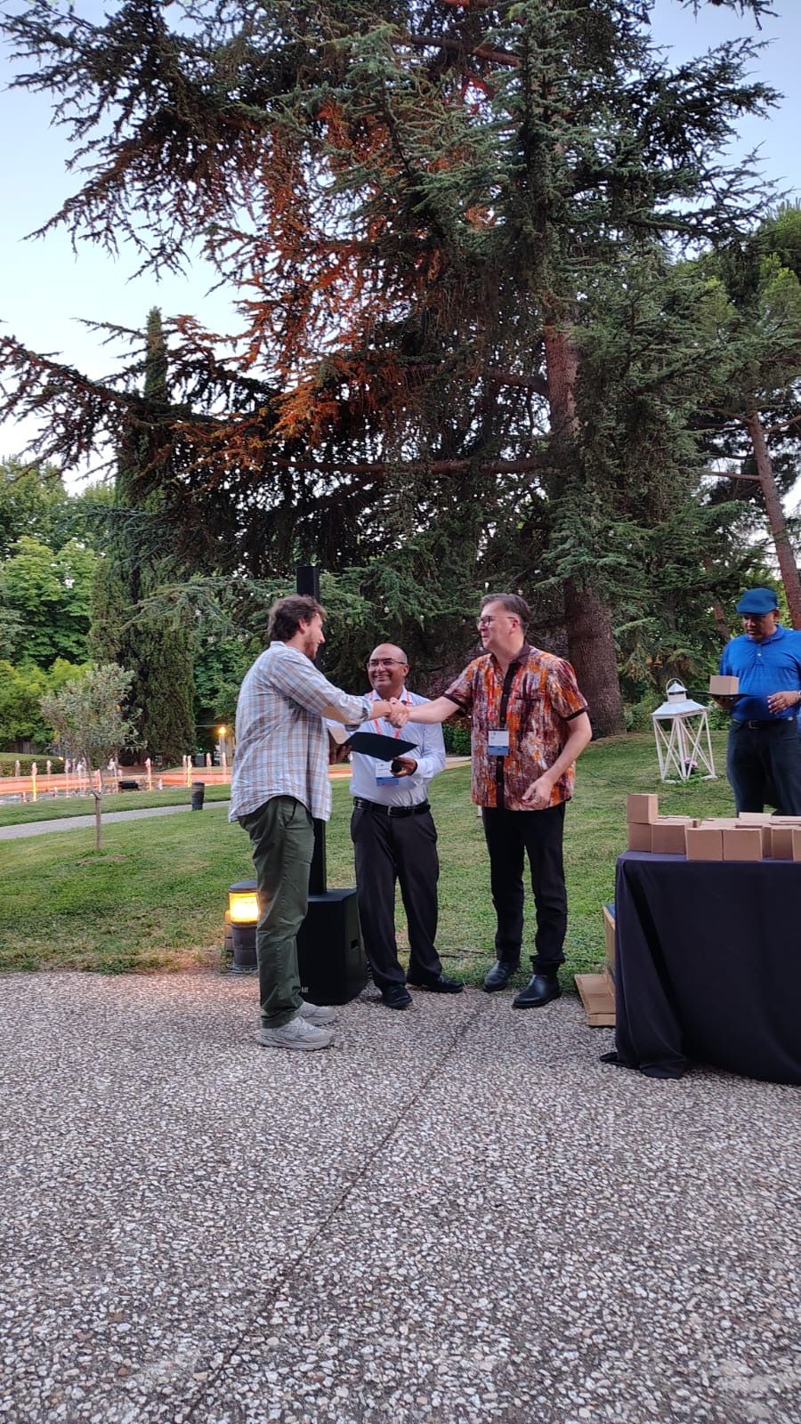 Certificate handover at the COMPSAC 2026 conference banquet
