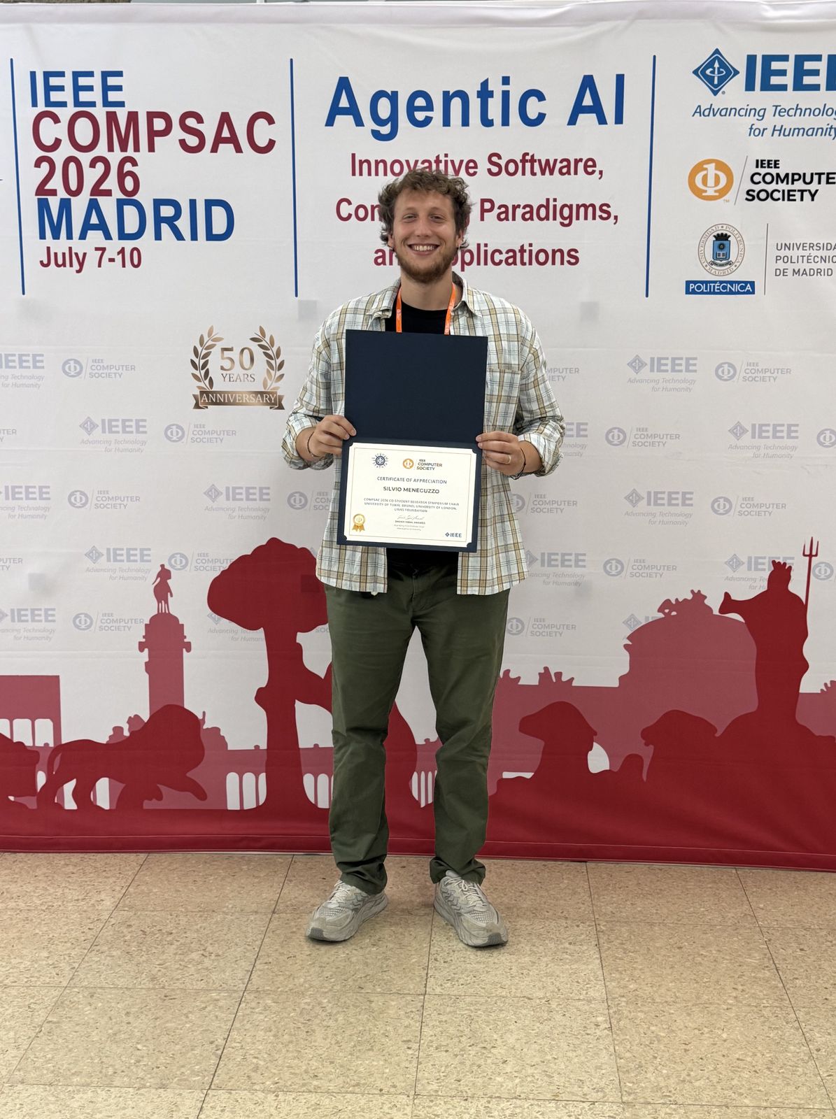 Silvio Meneguzzo holding the IEEE Computer Society Certificate of Appreciation at COMPSAC 2026 in Madrid
