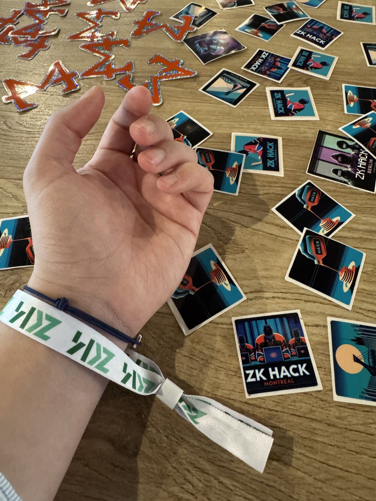zkSummit14 wristband and ZK Hack stickers