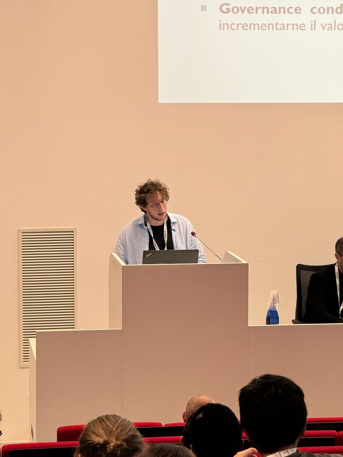Silvio Meneguzzo speaking at the podium during the CrypTO Conference 2025